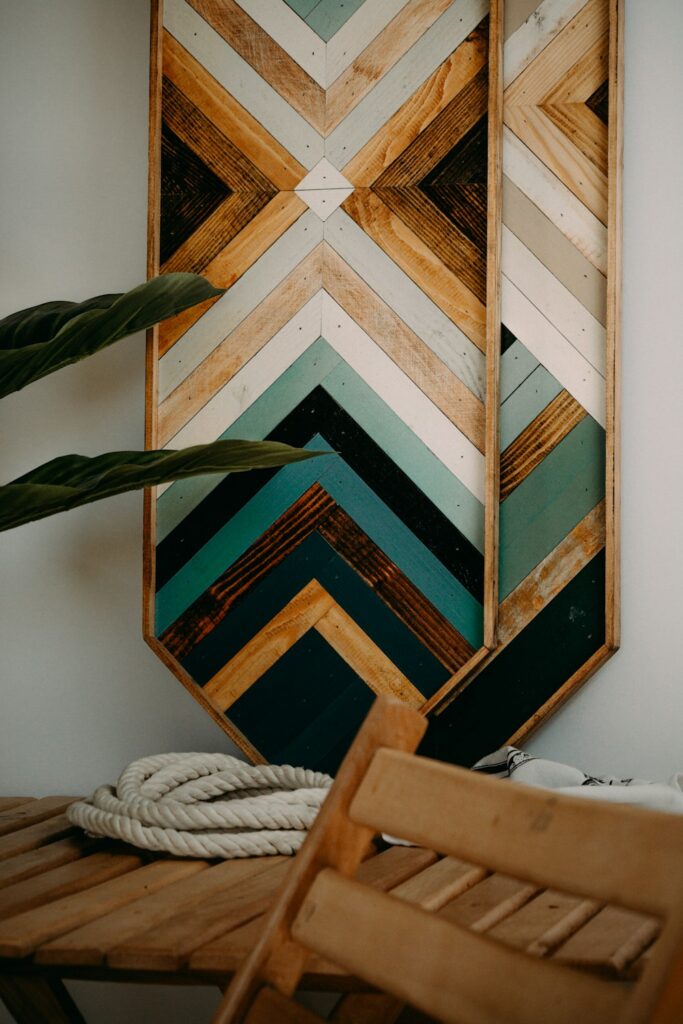a wooden chair sitting next to a wooden wall