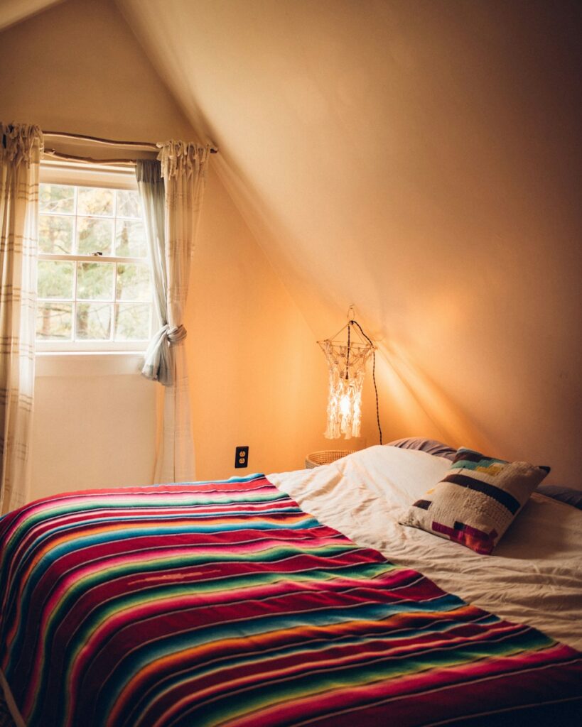 multicolored striped bed comforter. Warm Bedroom Aesthetic Ideas